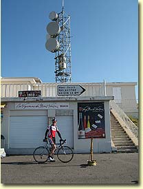 Greg at the summit sign