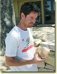 Justin holding whale vertebra found in Bone Rock